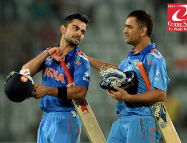 India captain Mahendra Singh Dhoni (R) greets batsman Virat Kohli (L)after India won the ICC World Twenty20 cricket tournament second semi-final match against South Africa at The Sher-e-Bangla National Cricket Stadium in Dhaka on April 4, 2014. India plays Sri Lanka in the final.   AFP PHOTO/ PUNIT PARANJPE        (Photo credit should read PUNIT PARANJPE/AFP/Getty Images)