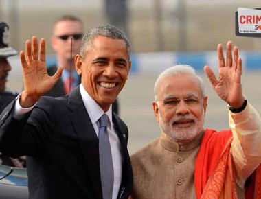 NEW DELHI, INDIA  JANUARY 26: Prime Minister Narendra Modi with visiting US President Barack Obama waves upon his  arrival in New Delhi.(Photo by Shekhar Yadav/India Today Group/Getty Images)