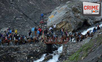 Indian Hindu devotees walk at the start of the annual journey from Baltal Base Camp to the holy Amarnath Cave shrine in Baltal near Srinagar on July 2, 2015. Thousands of Hindu pilgrims on July 2, 2015 began trekking along icy trails to reach a cave shrine high in the mountains of India's restive Kashmir amid tight security. Every year, hundreds of thousands of devout Hindus from India and abroad make the gruelling trek to the Amarnath shrine -- 3,800 meters (12,800 ft) up in the Himalayas -- to see the natural ice formation that is worshipped as a symbol of Shiva, the god of destruction. AFP PHOTO/Tauseef MUSTAFA