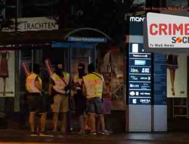 Masked police stand at a bus stop in front of the Olympia mall where a shooting took place in Munich, southern Germany, Friday, July 22, 2016. Police said that at least 8 people have been killed. (AP Photo/Sebastian Widmann)