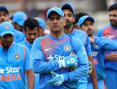 India captain Mahendra Singh Dhoni leads his team after victory during the third and final T20 cricket match in a serie of three games between India and Zimbabwe in the Prayag Cup at Harare Sports Club, on June 22, 2016.
Zimbabwe won the toss and elected to bowl in Wednesdays third and decisive Twenty20 international at Harare Sports Club, giving India their first opportunity to post a total on their short tour. / AFP / Jekesai Njikizana        (Photo credit should read JEKESAI NJIKIZANA/AFP/Getty Images)