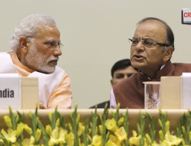 NEW DELHI, INDIA  FEBRUARY 17: Prime Minister Narendra Modi and Finance Minister Arun Jaitley during a function to celebrate the elevation of Kuriakose Elias Chavara and Mother Euphrasia to sainthood on February 17, 2015 in New Delhi, India. Prime Minister Modi has said that his government will ensure that there is complete freedom of faith and that everyone has the undeniable right to retain or adopt the religion of his or her choice without coercion or undue influence. (Photo by Virendra Singh Gosain/Hindustan Times via Getty Images)