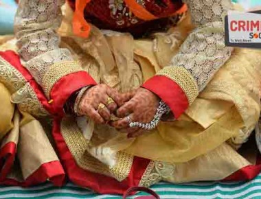 A young Indian Muslim girl sits among her elders during Eid-al-Fitr prayers at Chamrajpet Idgah Maidan in Bangalore on July 7, 2016. 

The three-day festival, which begins after the sighting of a new crescent moon, marks the end of the fasting month of Ramadan during which devout Muslims abstain from food and drink from dawn to dusk. / AFP / MANJUNATH KIRAN        (Photo credit should read MANJUNATH KIRAN/AFP/Getty Images)