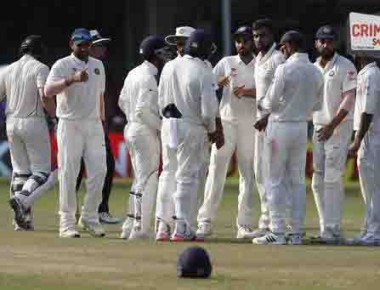 India's Ravichandran Ashwin, fourth right, and team celebrates the wicket of New Zealand's Kane Williamson on the fourth day of their first cricket test match at Green Park Stadium in Kanpur, India, Sunday, Sept. 25, 2016. (AP Photo/ Tsering Topgyal)