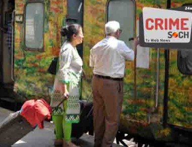 Indian passengers check the reservation chart posted on a train carriage at Secunderabad Railway Station in Hyderabad on February 25, 2016, as Indian Railways Minister Suresh Prabhu presents The Railway Budget at Parliament House in New Delhi.   AFP PHOTO / Noah SEELAM / AFP PHOTO / NOAH SEELAM