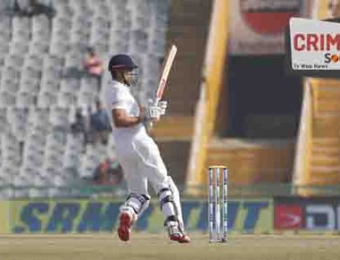 England's captain Alastair Cook plays a shot on the first day of their third cricket test match against India in Mohali, India, Saturday, Nov. 26, 2016. (AP Photo/Altaf Qadri)