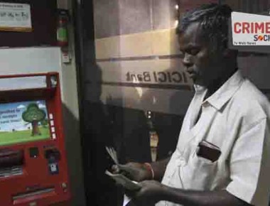 An Indian man counts currency after withdrawing from an ATM in Hyderabad, India, Friday, Nov. 11, 2016. Delivering one of India's biggest-ever economic upsets, Prime Minister Narendra Modi this week declared the bulk of Indian currency notes no longer held any value and told anyone holding those bills to take them to banks to deposit or exchange them. (AP Photo/Mahesh Kumar A.)