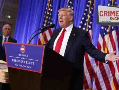 President-elect Donald Trump, accompanied by Vice President-elect Mike Pence, speaks during a news conference in the lobby of Trump Tower in New York, Wednesday, Jan. 11, 2017. (AP Photo/Evan Vucci)