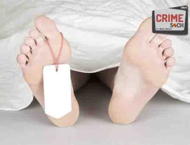 Dead body with toe tag, under a white sheet