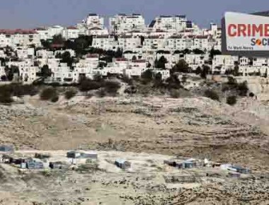 The Israeli settlement of Maaleh Adumim looms over Arab Bedouin shacks in the West Bank, Sunday, Jan. 22, 2017. The municipality of Jerusalem has granted final approval for the construction of hundreds of new homes in east Jerusalem, while a hard-line Cabinet minister pushed the government to annex Maaleh Adumim, a major West Bank settlement as emboldened Israeli nationalists welcomed the presidency of Donald Trump. The building plans were put on hold in the final months of President Barack Obama's administration. (AP Photo/Mahmoud Illean)