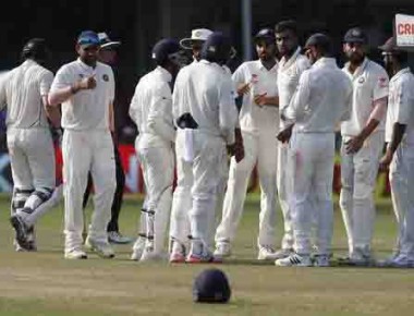 India's Ravichandran Ashwin, fourth right, and team celebrates the wicket of New Zealand's Kane Williamson on the fourth day of their first cricket test match at Green Park Stadium in Kanpur, India, Sunday, Sept. 25, 2016. (AP Photo/ Tsering Topgyal)