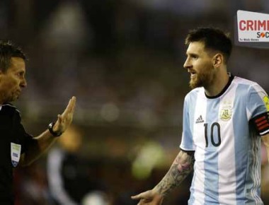 In this photo taken Thursday March 23, 2017 Argentina's Lionel Messi argues assistant referee Emerson Augusto de Carvalho during a World Cup qualifying match against Chile in Buenos Aires, Argentina. Messi has been banned from Argentina's next four World Cup qualifiers, starting with Tuesday's game in Bolivia, for "having directed insulting words at an assistant referee" during a home qualifier against Chile on Thursday, FIFA said hours before kickoff in La Paz.(AP Photo/Victor R. Caivano)