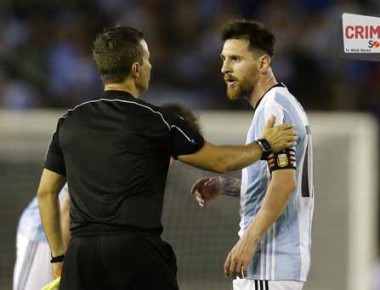 In this March 23, 2017 photo made available Tuesday, March 28, 2017, Argentina's Lionel Messi, right, argues with assistant referee Emerson Augusto de Carvalho during a 2018 Russia World Cup qualifying soccer match between Argentina and Chile at the Monumental stadium in Buenos Aires, Argentina. (AP Photo/Victor R. Caivano)