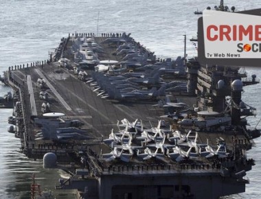 FILE - In this March 15, 2017 file photo, U.S. Navy aircraft carrier, the USS Carl Vinson approaches to participate in the annual joint military exercise called Foal Eagle between South Korea and the United States, at Busan port in Busan, South Korea. The Pentagon says a Navy carrier strike group is moving toward the western Pacific Ocean to provide a physical presence near the Korean Peninsula. North Korea's recent ballistic missile tests and continued pursuit of a nuclear program have raised tensions in the region, where U.S. Navy ships are a common presence and serve in part as a show of force. The U.S. Pacific Command directed the carrier group, that includes USS Carl Vinson, to sail north to the western Pacific after departing Singapore on Saturday, April 8, according to a Navy news release. (Jo Jung-ho/Yonhap via AP, File)