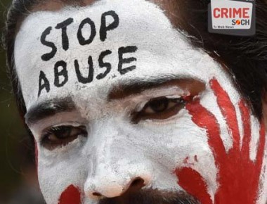 An Indian activist of "The Red Brigade - Bring Bangalore Back" participates in a rally to protest against the recent incidents of sexual abuse, molestation and rapes against women in Bangalore on July 20, 2014. The protestors demanded police take action against sexual offenders, child sexual abuse and rapists after several cases of sexual violence against women were registered in Bangalore in the last few days. AFP PHOTO/Manjunath Kiran / AFP / Manjunath Kiran