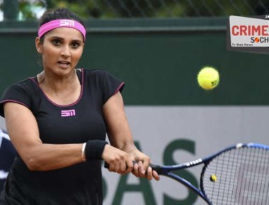 India's Sania Mirza and Croatia's Ivan Dodig (not pictured) return the ball to Croatia's Darija Jurak and Croatia's Mate Pavic during their mixed doubles tennis match at the Roland Garros 2017 French Open on June 2, 2017 in Paris.  / AFP PHOTO / FRANCOIS XAVIER MARIT