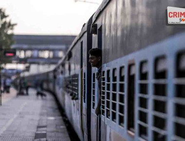 A passenger stands in a carriage doorway on the Kalka Mail train as it stands at Mughalsarai Junction station in Mughalsarai, Uttar Pradesh, India, on Thursday, Oct. 1, 2015. The 162-year-old system is Asia's oldest. It is the nation's economic artery, employer of more than 1.3 million people, and the government's most intractable problem. Unclogging its 65,000 kilometers of track is vital to any effort to develop the economy. Photographer: Dhiraj Singh/Bloomberg via Getty Images