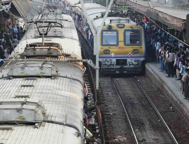 Mumbai: Commuters wait to board trains at a railway station on the eve of the Railway Budget in Mumbai on Wednesday. PTI Photo by Mitesh Bhuvad  (PTI2_24_2016_000243B)